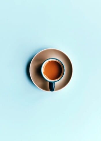 coffee cup on cyan background coffee cup on cyan background